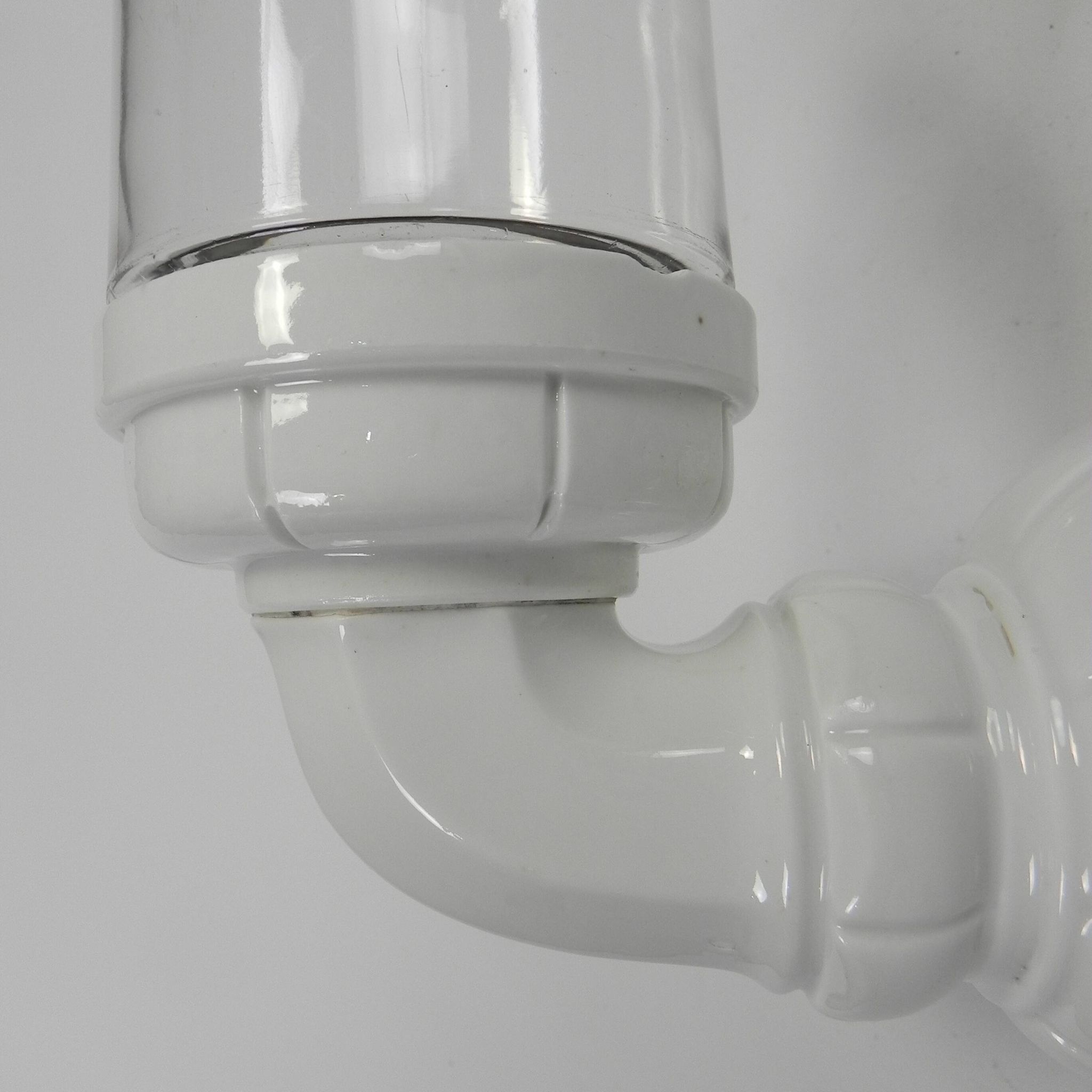 Wall lamp in porcelain with a transparent glass shade, 1930s.