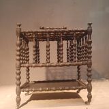 Rosewood magazine rack on casters