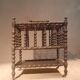 Rosewood magazine rack on casters
