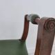 Green curule armchair