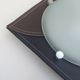 Wall light or ceiling light in frosted glass and leather-like material.