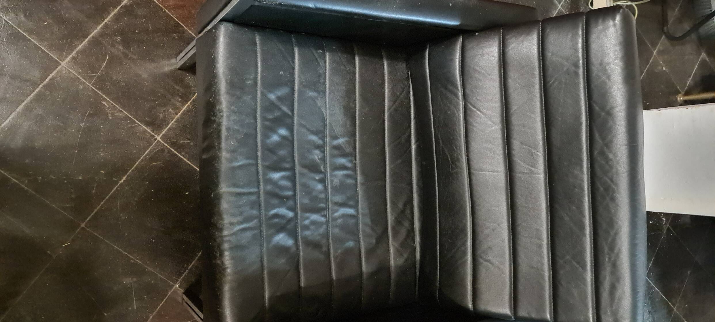Vintage black leather armchair by Stoll Geroflex