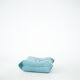 Ensemble de fauteuil et pouf Togo en velours côtelé bleu clair.