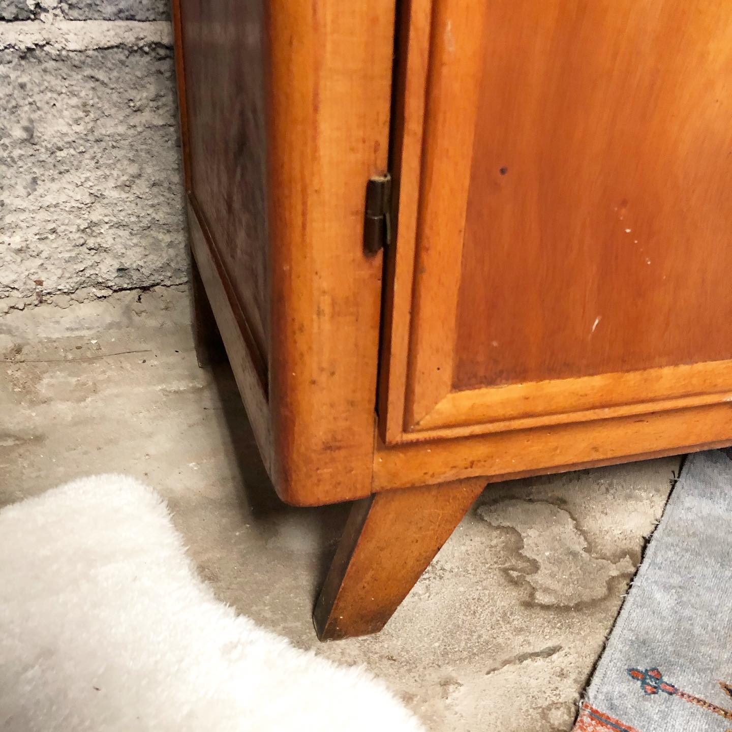 Vintage wooden cabinet with compass feet