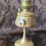 Repoussé brass lamp with floral motifs, decorated with 3 miniature medallions