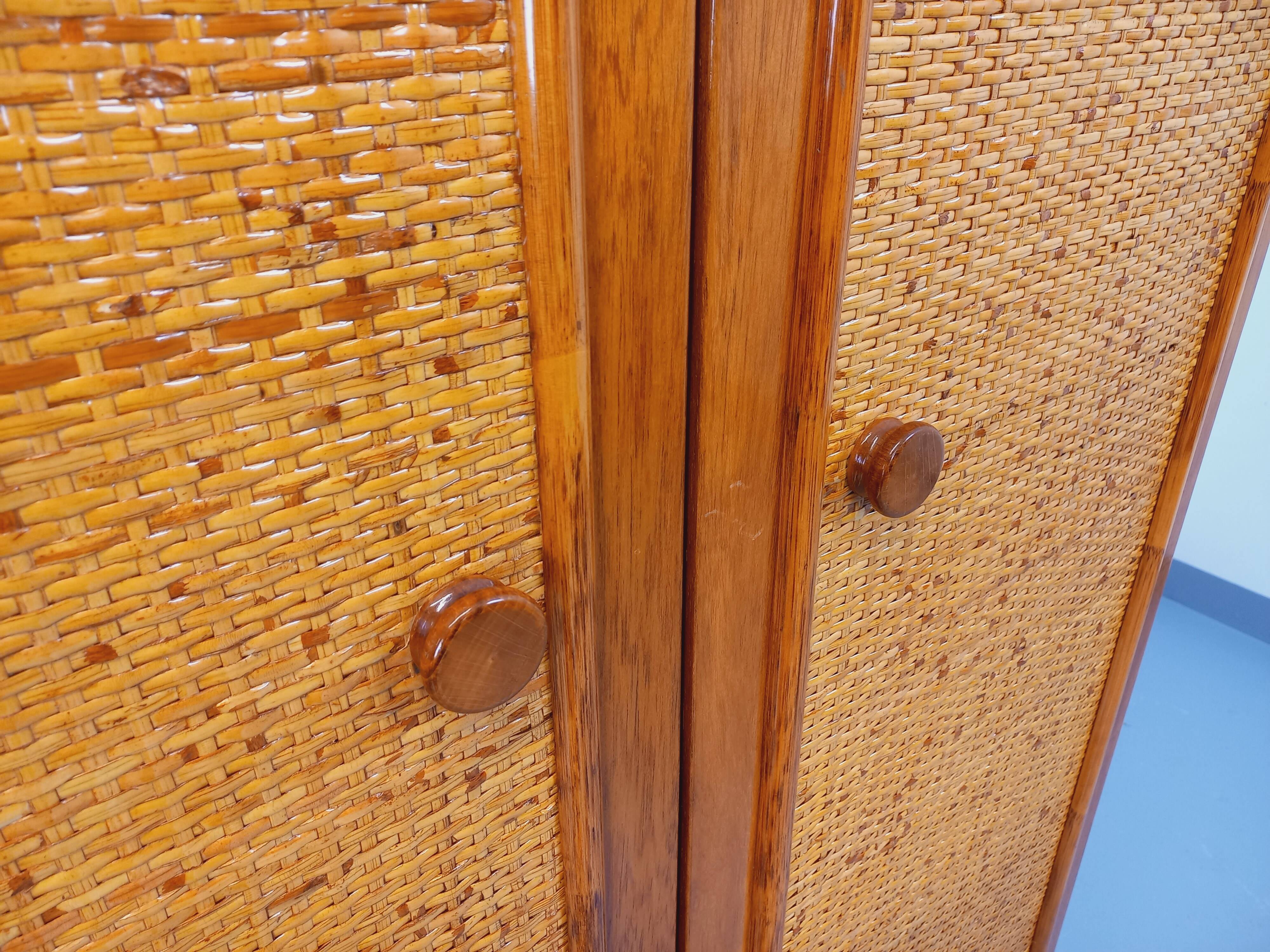 Vintage woven rattan and wood armoire by Maugrion for Roche-Bobois.
