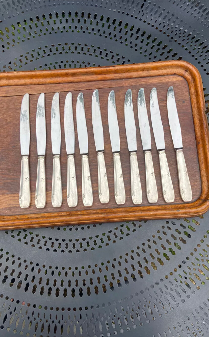Set of 11 large silver metal knives