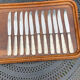 Set of 11 large silver metal knives