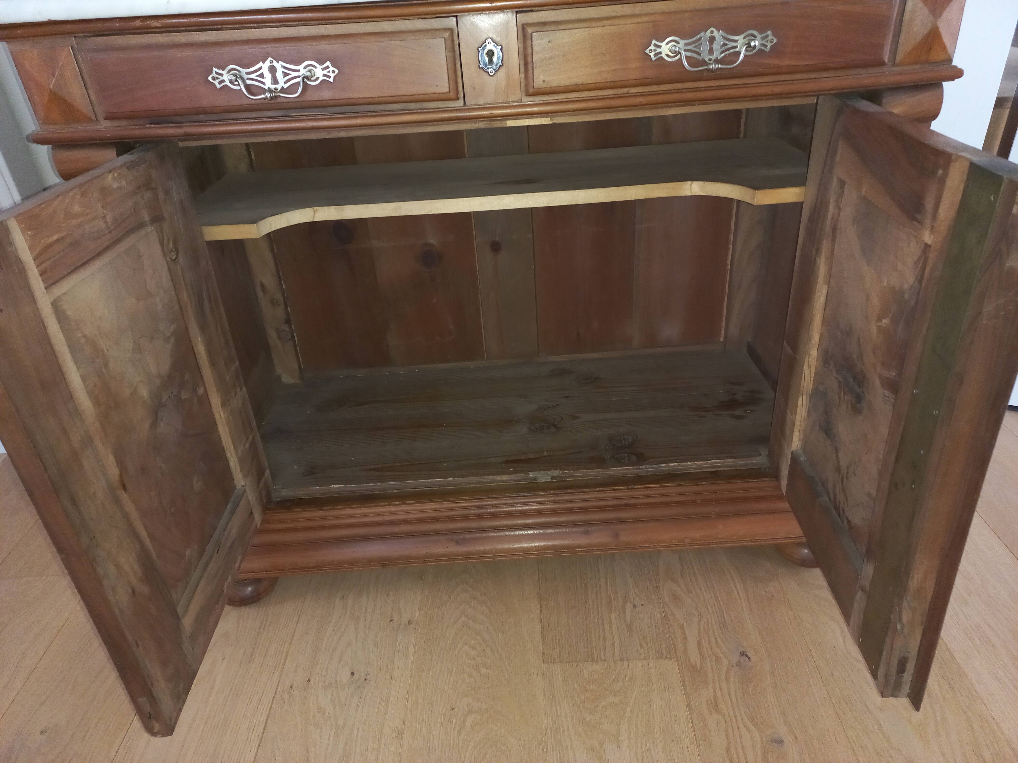 Empire period bathroom furniture in solid walnut and white marble.