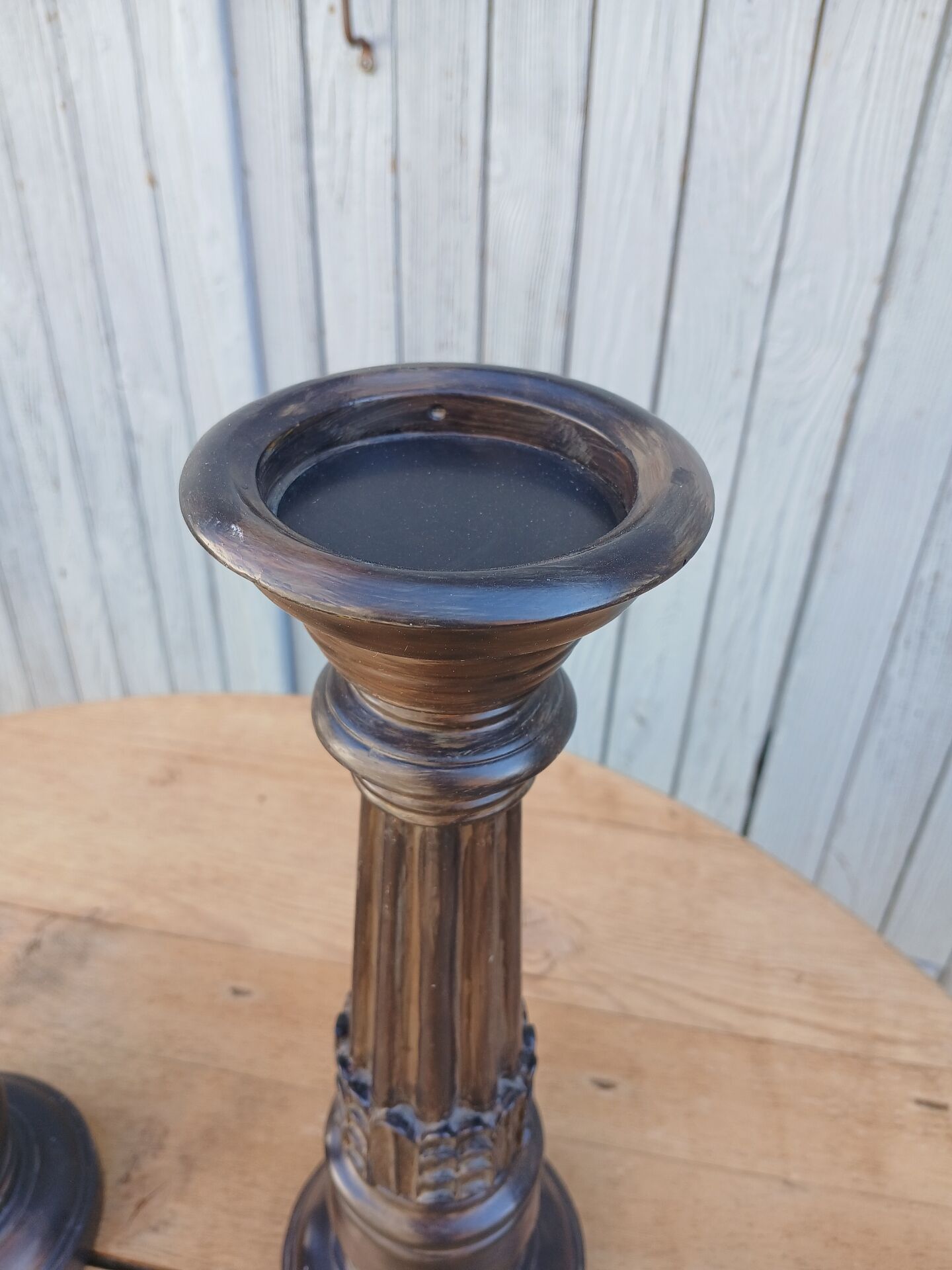 2 carved wooden candlesticks