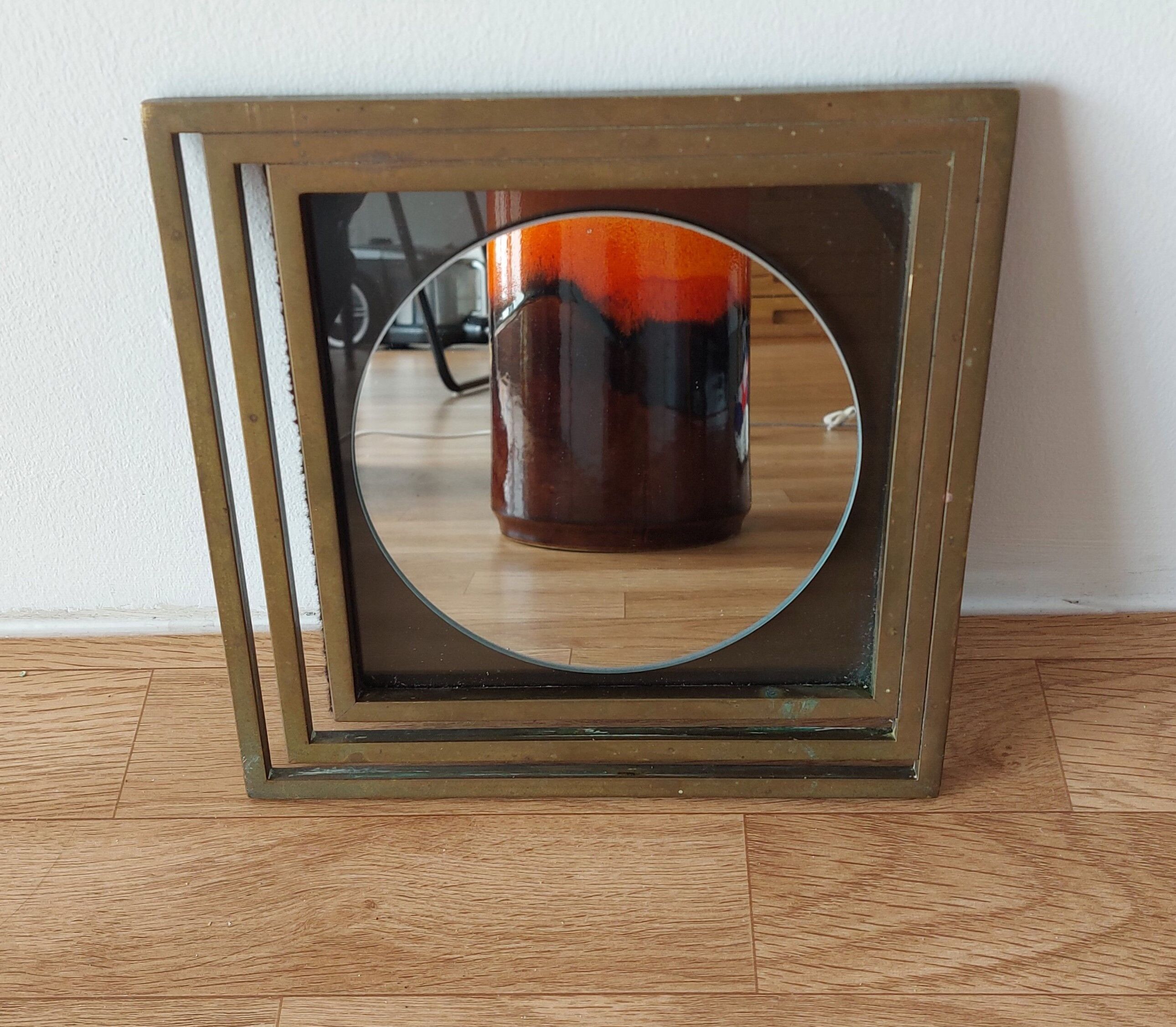 Modernist mirror in gilded brass 1960.