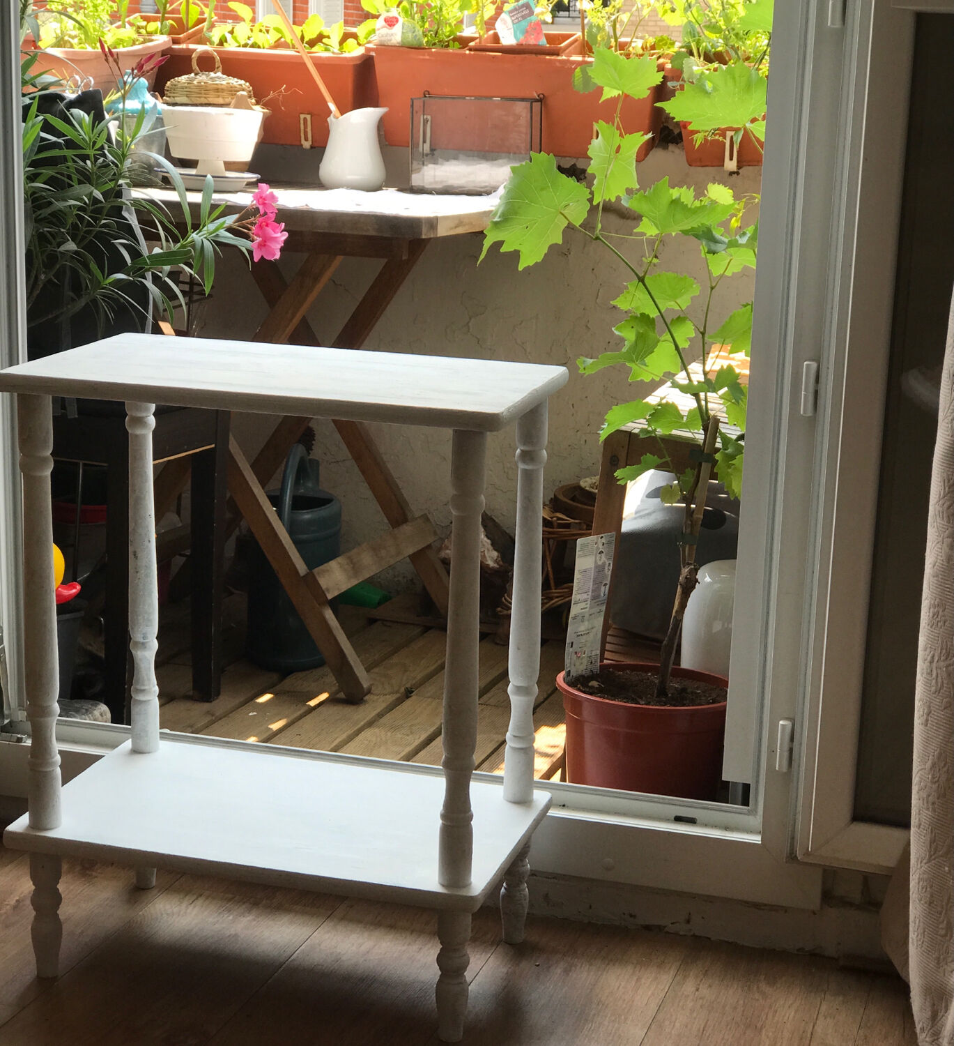 Vintage wooden side table with white patina