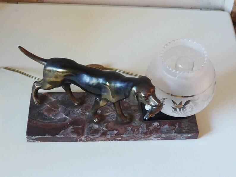 French Art Deco hunting dog on a marble base with a switched lamp.