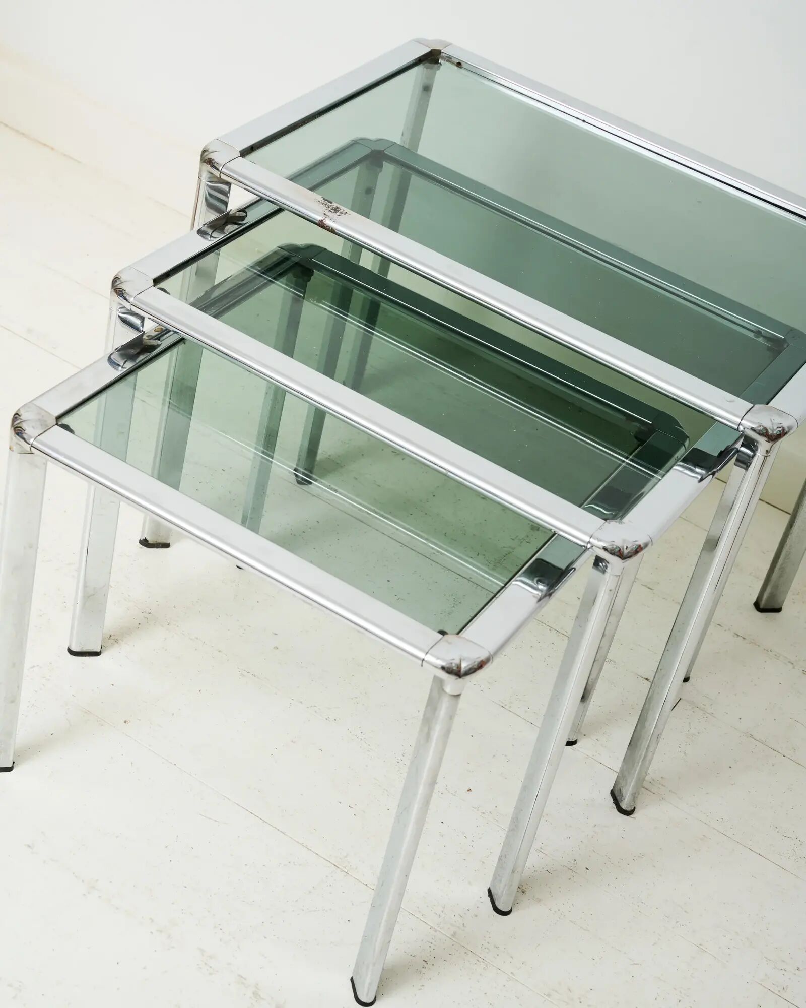 Nest tables in chrome and smoked glass, Italy, 1970s.