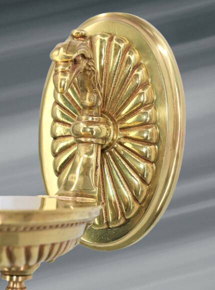 Pair of gilt bronze wall sconces in the Directoire style by Lucien Gau.