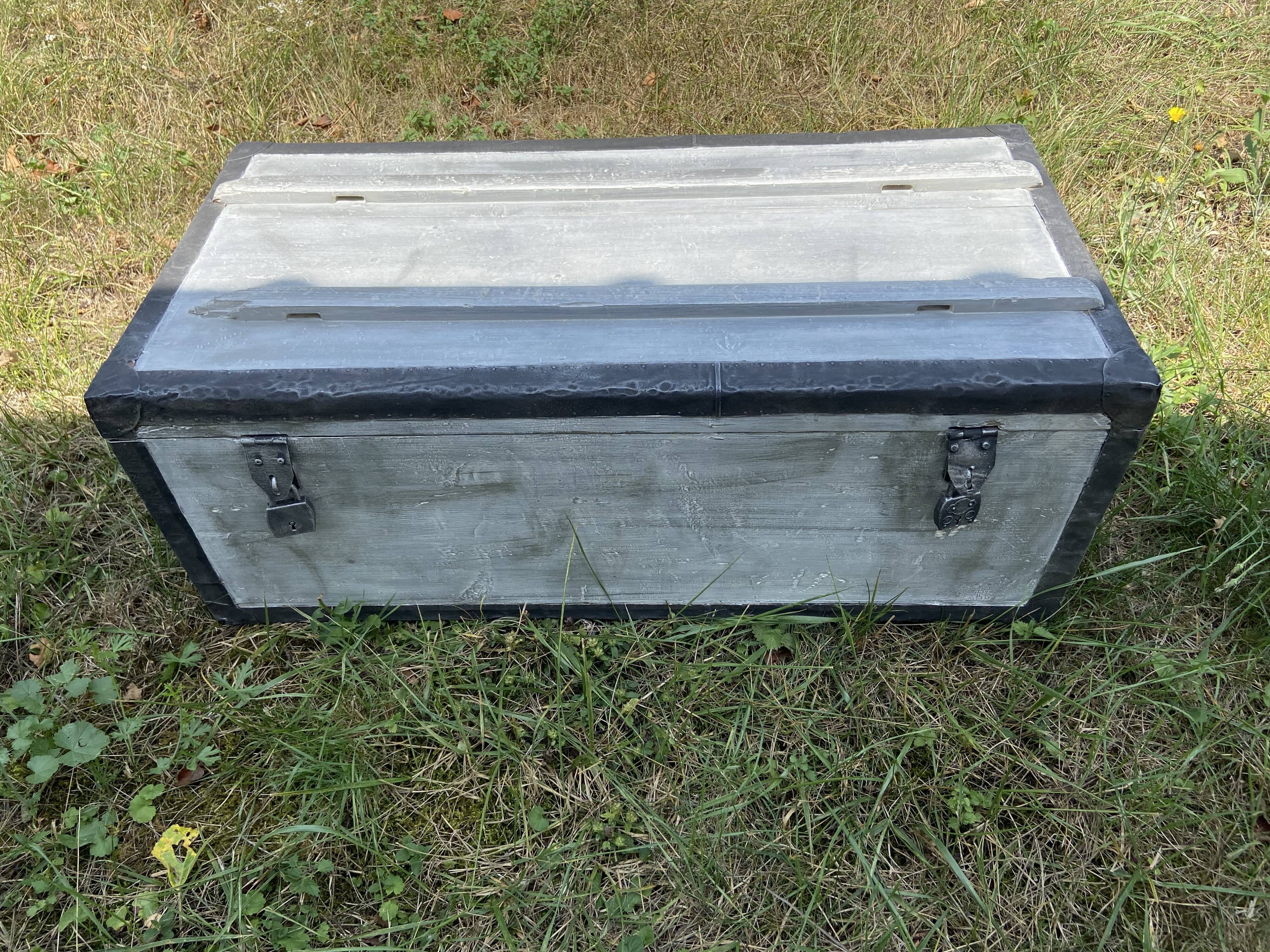 Restored wooden trunk patinated grey