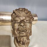 Head of satire in plaster