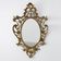 Miroir ovale en métal doré de style rococo, Italie, 20e siècle