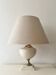 Dolphin lamp model "Oricourt" in ceramic and brass, France 1970.
