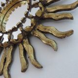 Sun mirror in gilded wood with inlays