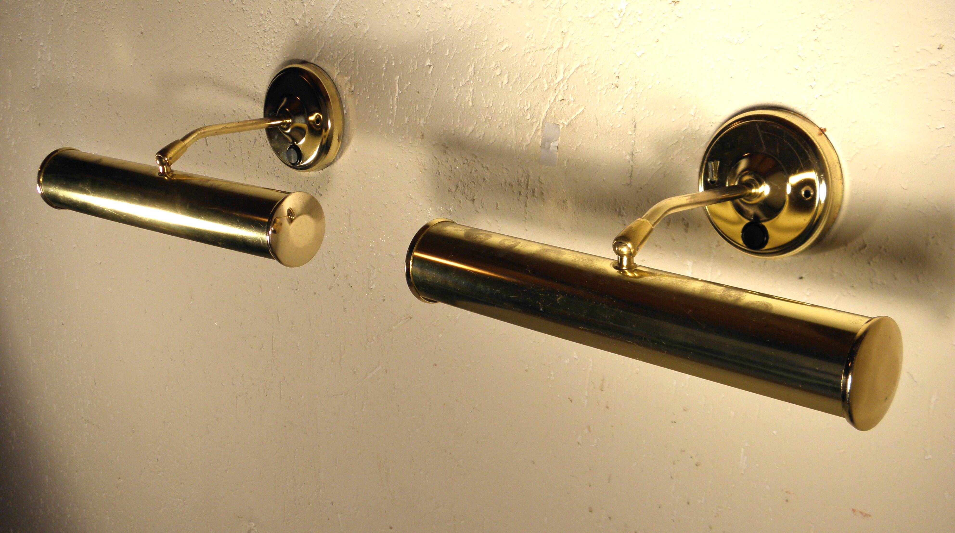 Two gold metal picture sconces