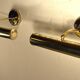 Two gold metal picture sconces
