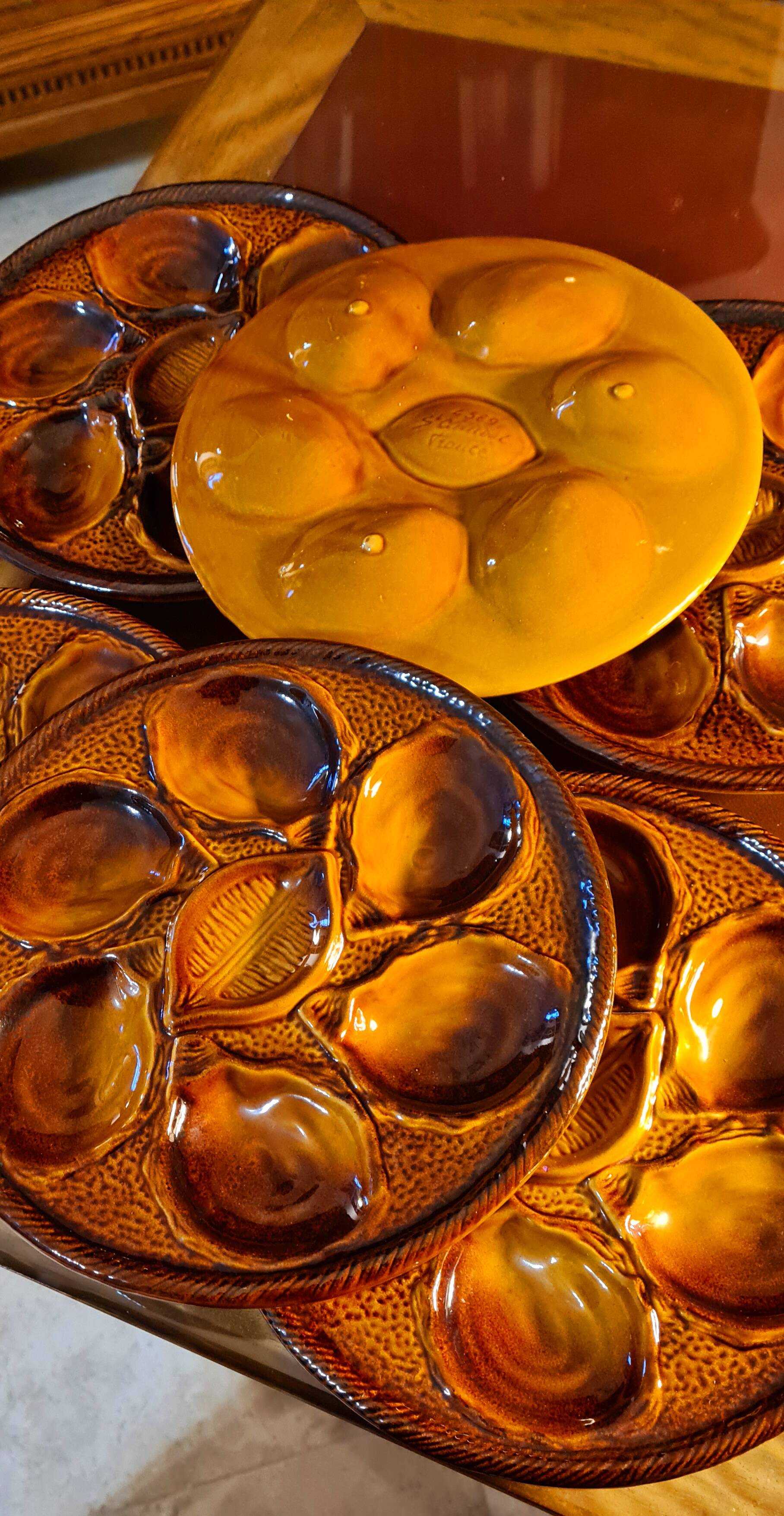 Six oyster plates signed Saint Clément