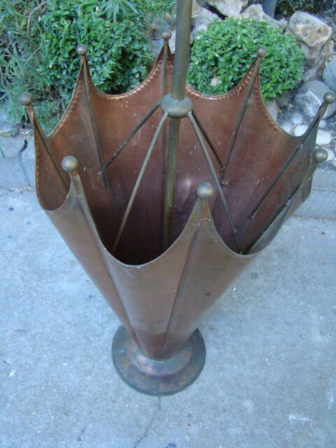 Old copper umbrella holder