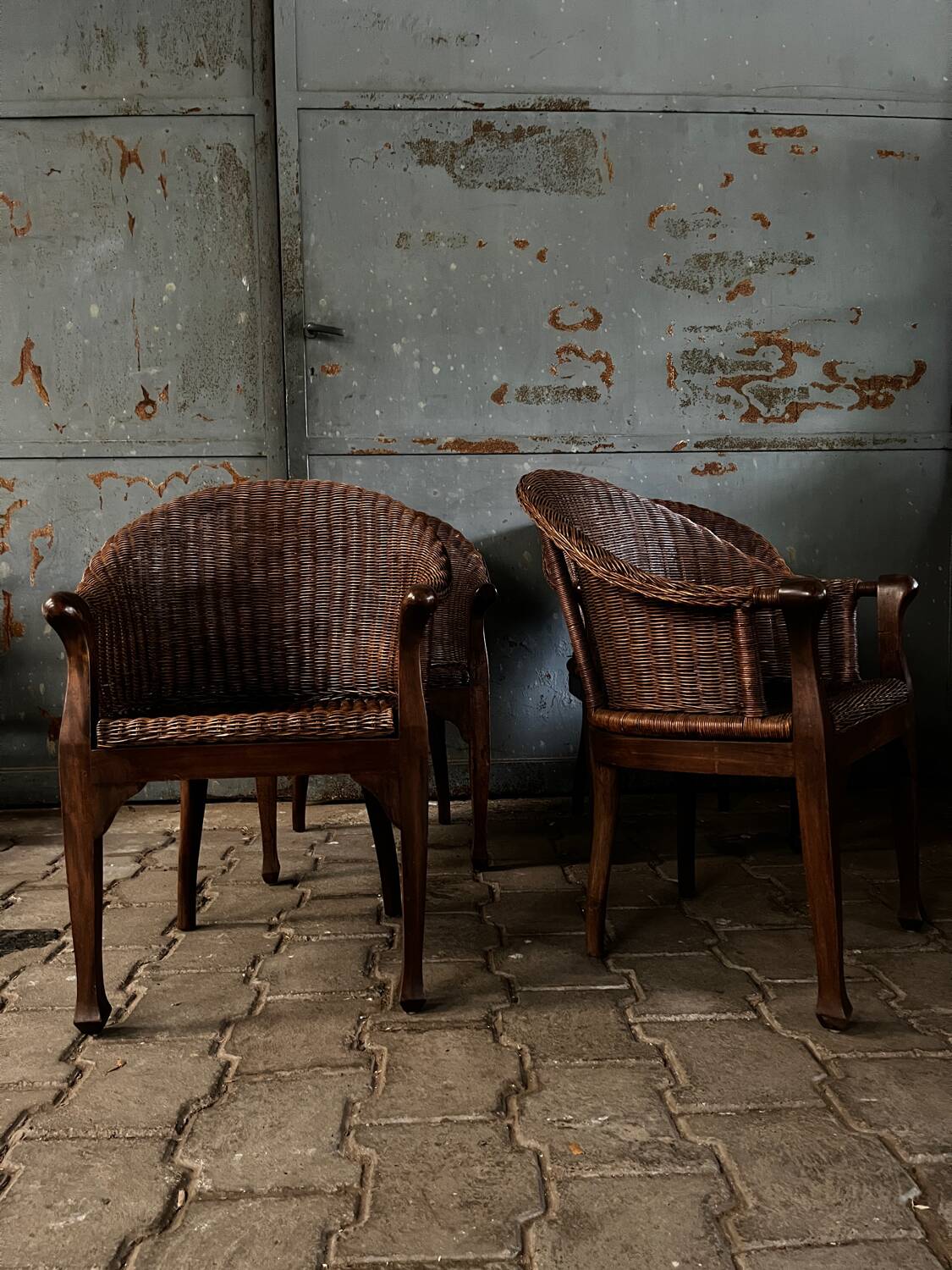 Arm chairs in dark rattan