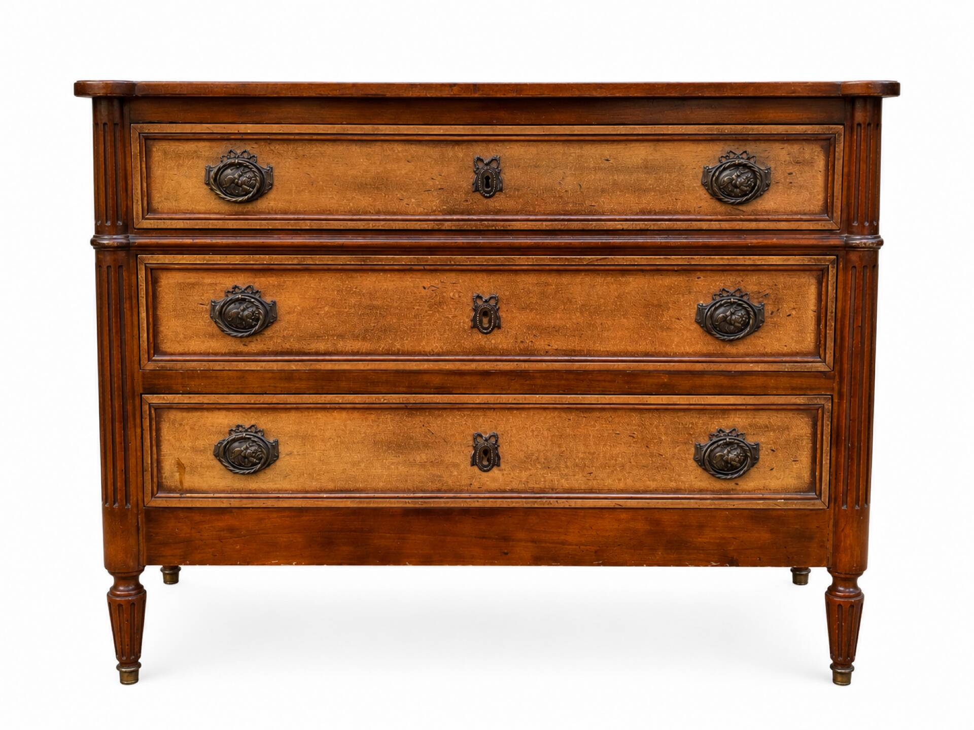 Light walnut commode in Louis XVI style with fluted motifs and three drawers.