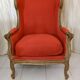 Fauteuil à oreilles en bois sculpté doré signé Maison Dienst Paris XIXeme siècle