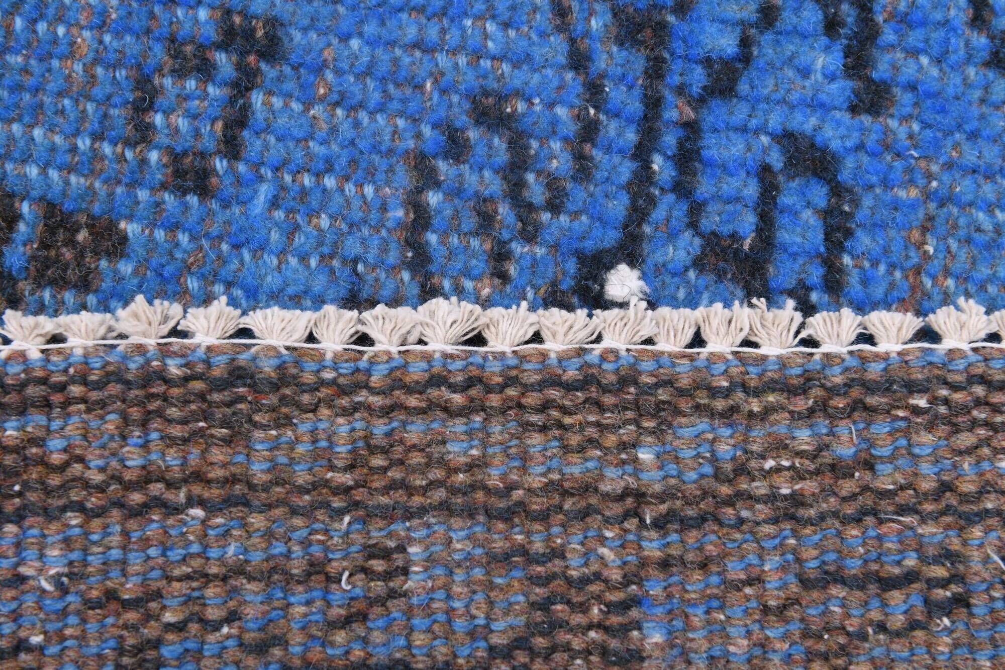 Vintage blue and black Turkish rug with traditional design, 163 × 268 cm