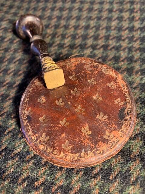 Very old round pocket mirror and leather case, 18th century