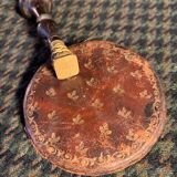 Very old round pocket mirror and leather case, 18th century