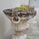 Pair of planter vases decorated with faces in reconstituted stone 1950s