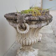 Pair of planter vases decorated with faces in reconstituted stone 1950s