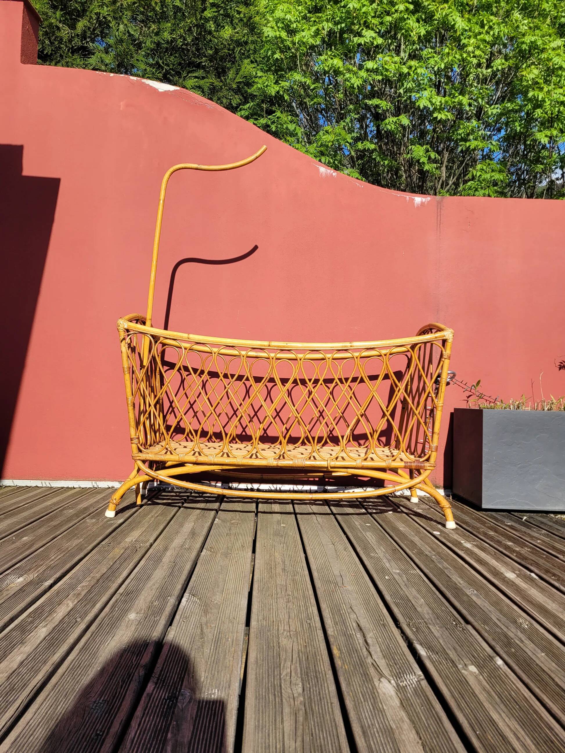 Bamboo and rattan baby cot with canopy.