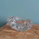 Shell-shaped crystal paperweight.