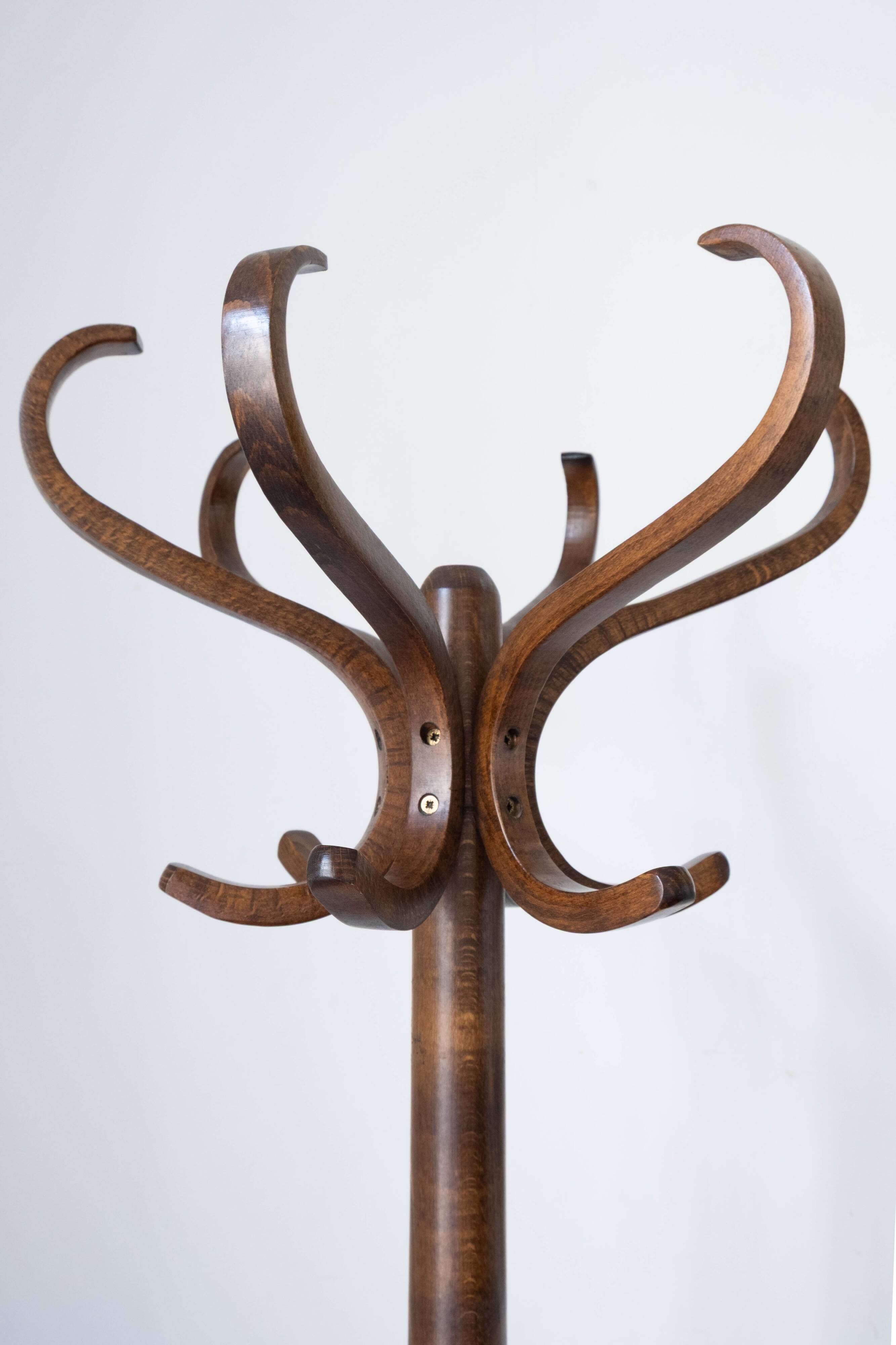 Baumann swivel parrot coat rack, dark wood.