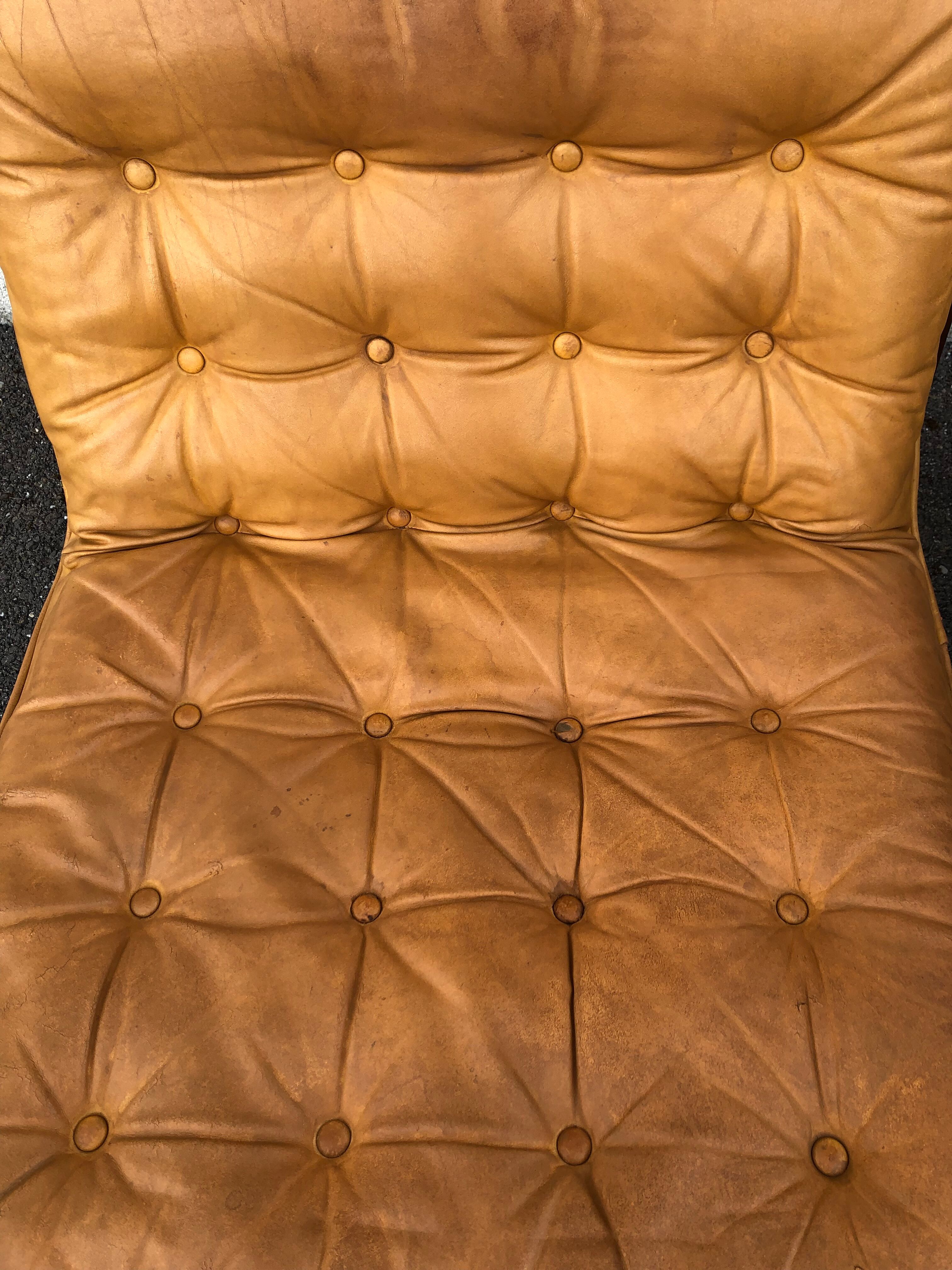 Leather and wood armchairs 70s