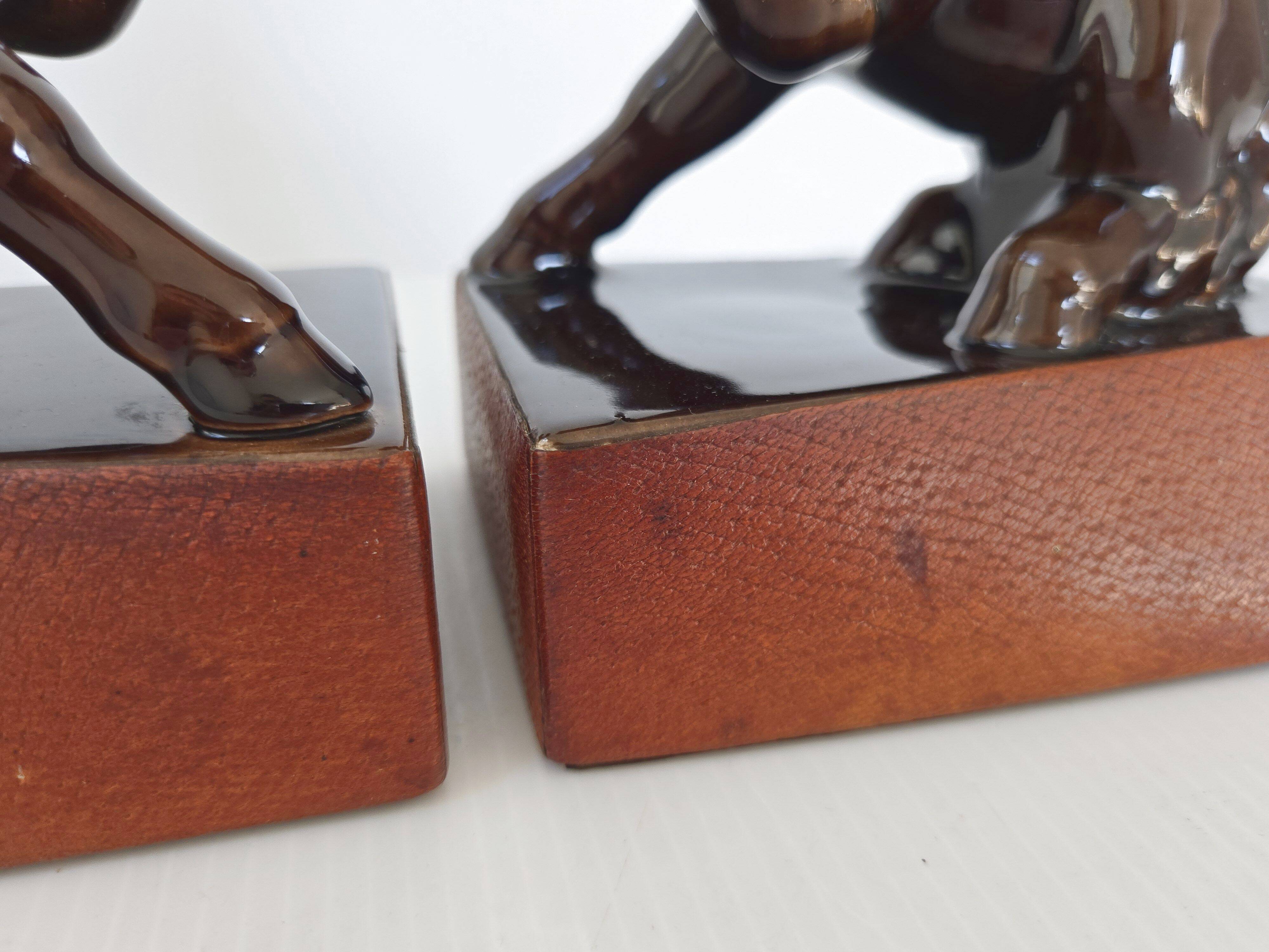 Pair of vintage leather & ceramic bookends