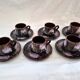 Six cups and saucers Vallauris glazed ceramic in brown and old pink.
