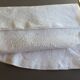 White embroidered organdie tablecloth and 12 assorted towels