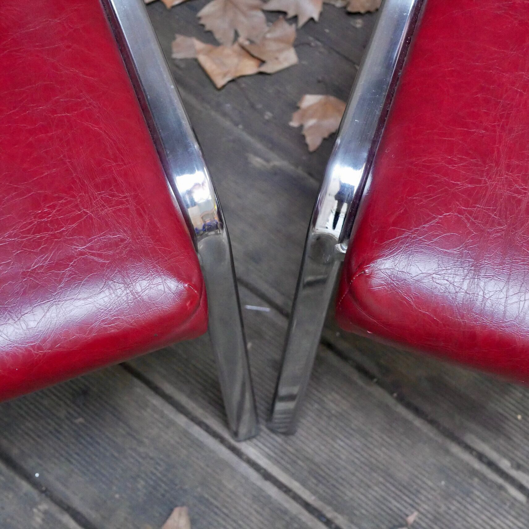Pair of red leatherette chairs