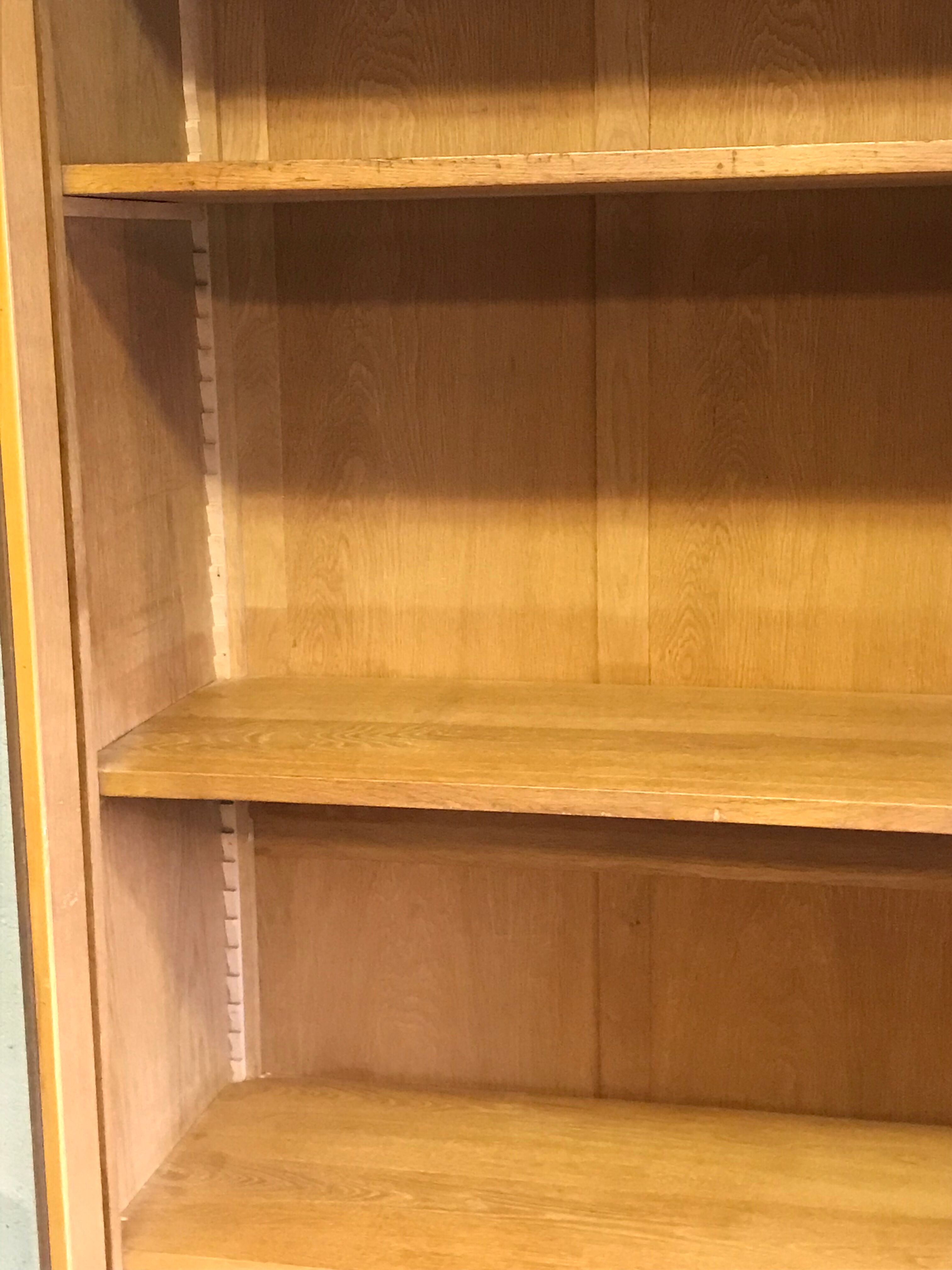 Old school glass bookcase in blond wood