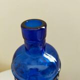 cobalt blue molded glass bottle in relief decoration bunches of grapes