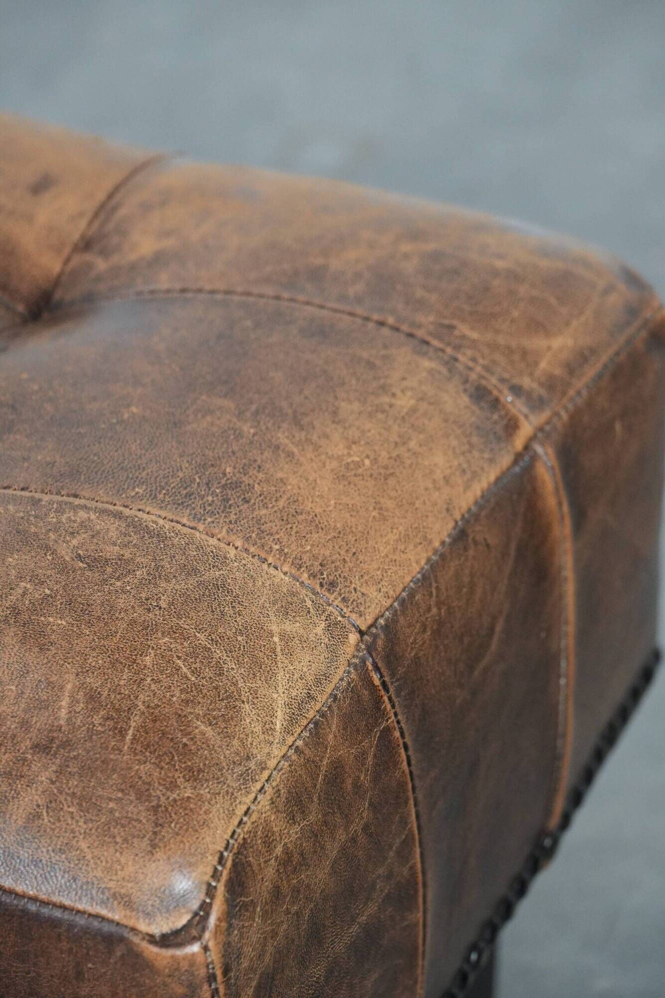 Beautiful sheepskin ottoman on high legs and beautiful warm colours