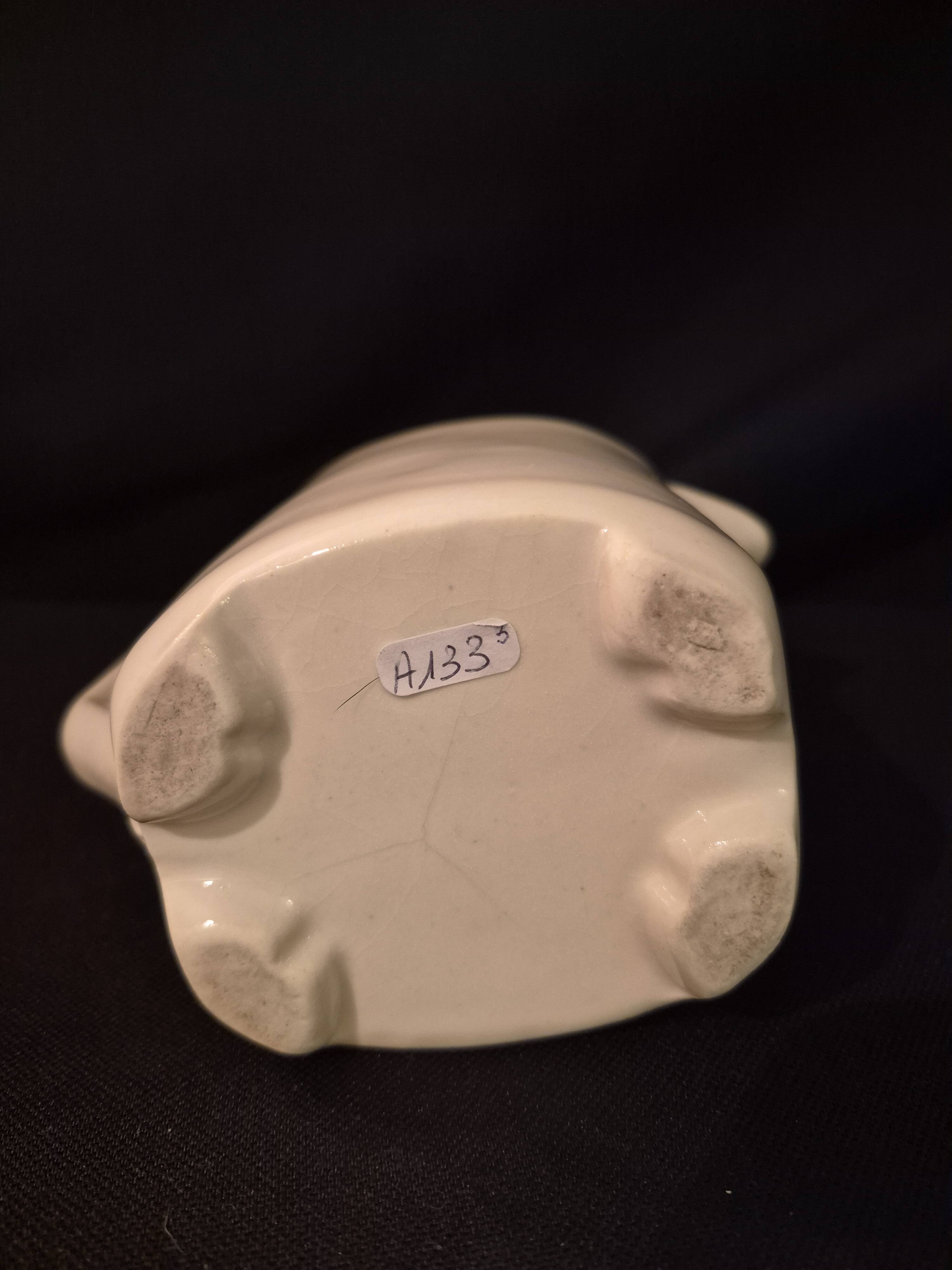 Old covered jug, vintage, geometric frieze with flowers and black trim.