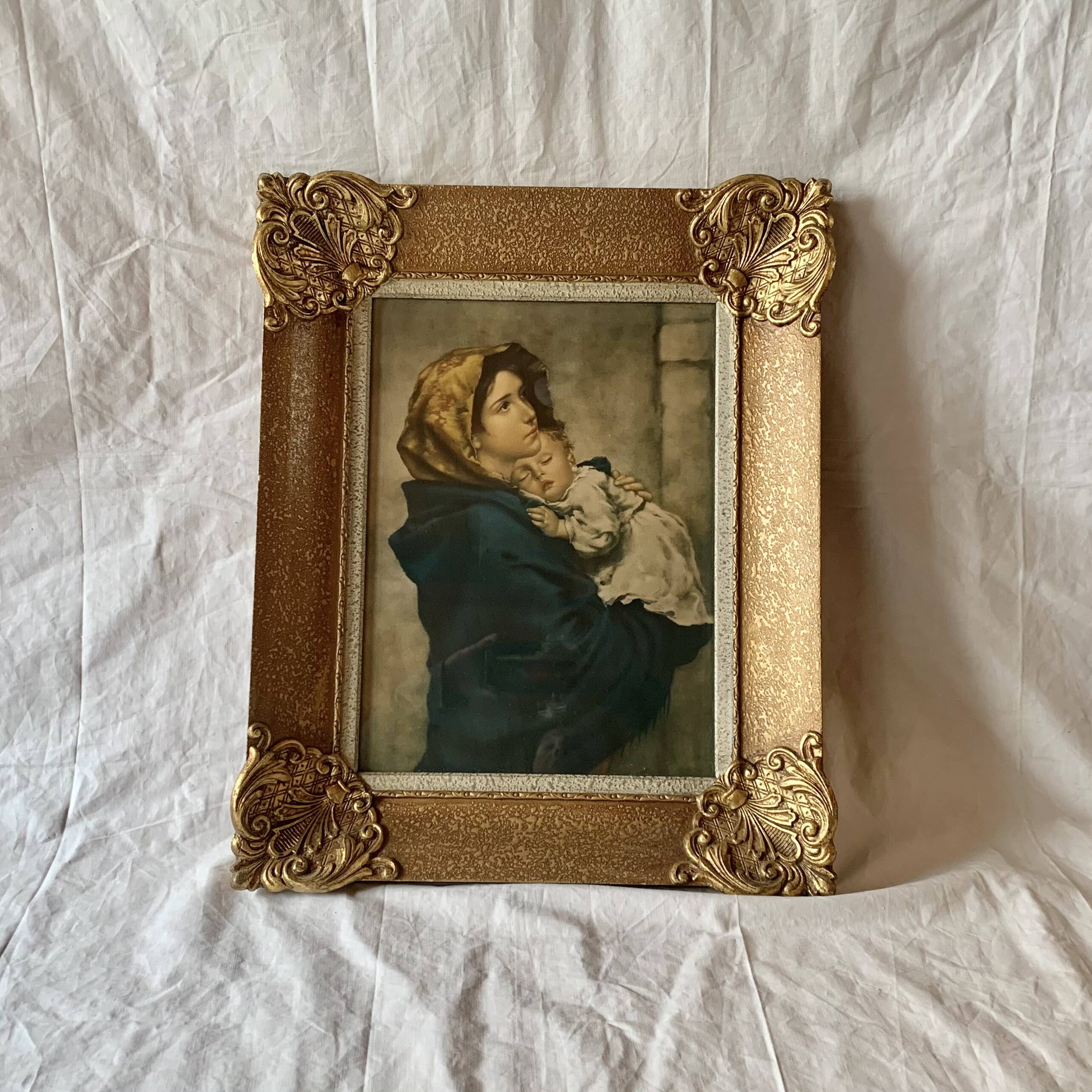 Old wall frame in carved gilded wood