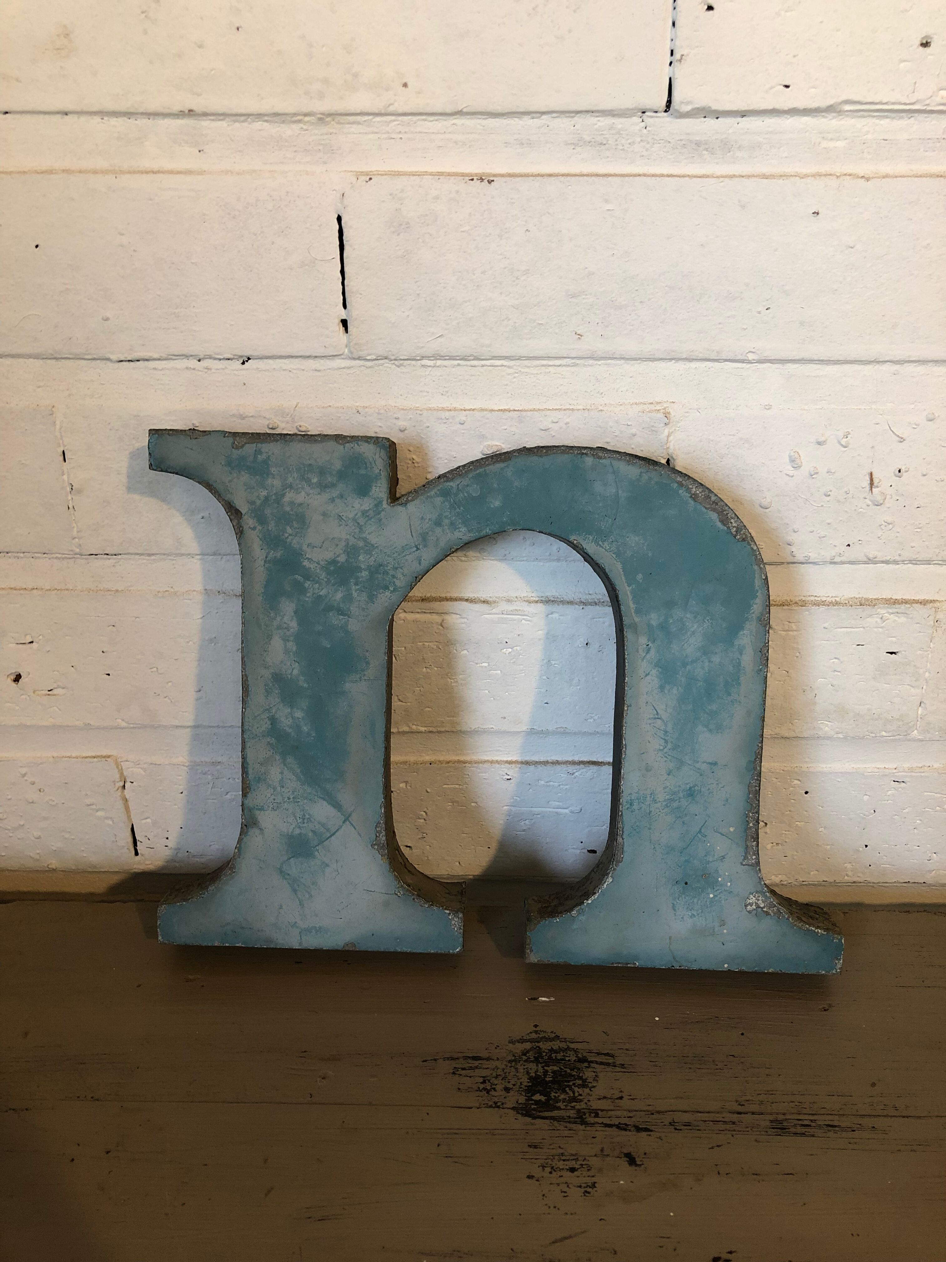 Blue metal letter "N"